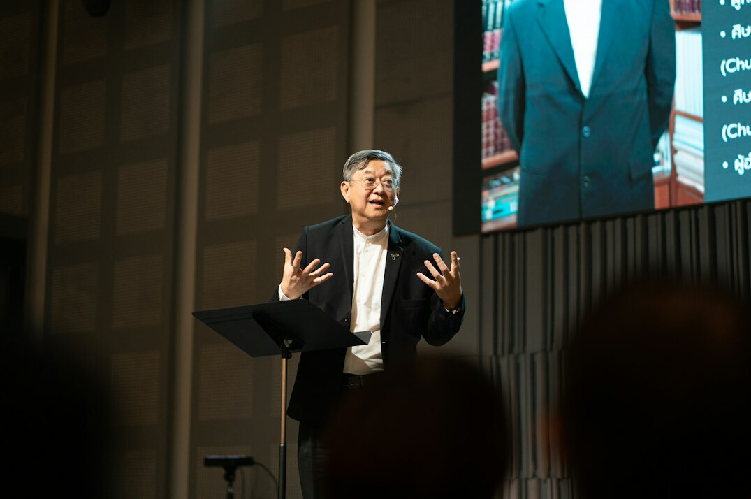 executive on stage presenting