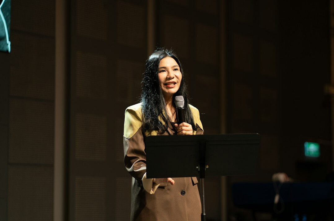 executive presenting on stage