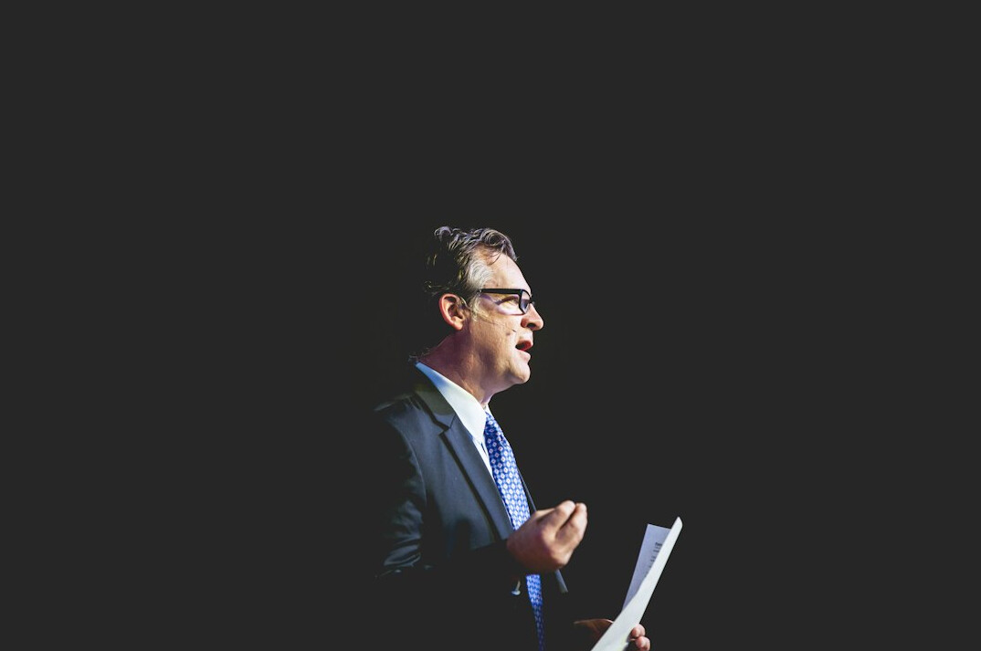 executive speaking confidently on stage