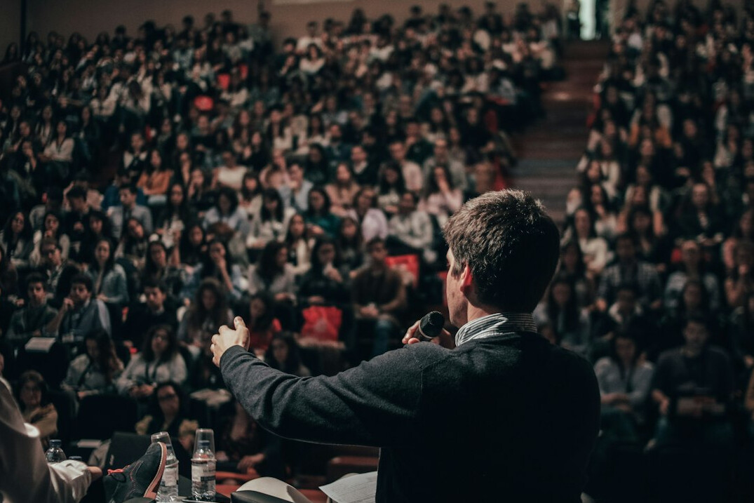 executive speaking on stage