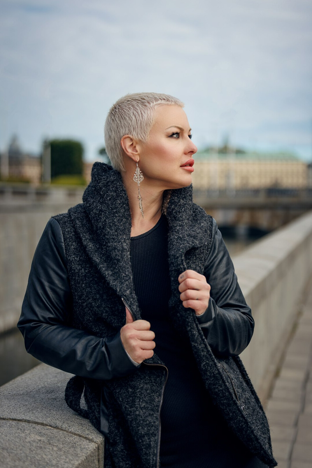 Portrait of a mature woman with short grey hair in a dark blazer